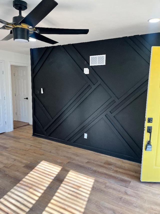 unfurnished room featuring light hardwood / wood-style flooring and ceiling fan