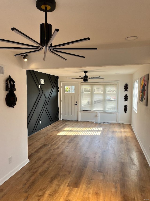 entryway with ceiling fan and hardwood / wood-style floors