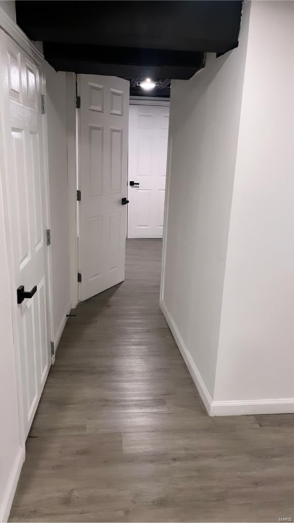 corridor featuring hardwood / wood-style flooring