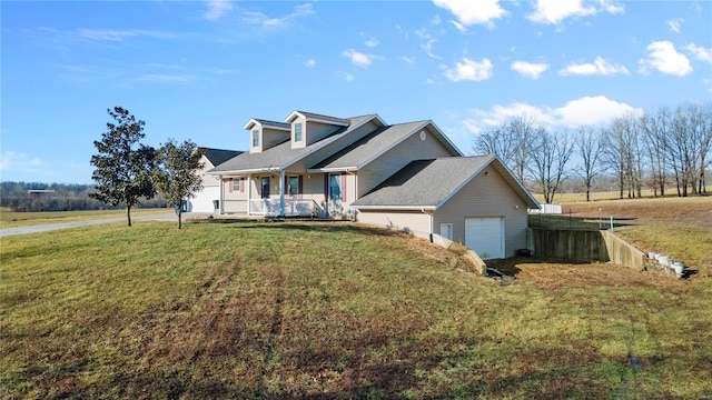 cape cod house featuring a garage, covered porch, and a front yard