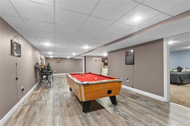 recreation room with billiards, hardwood / wood-style floors, and a drop ceiling