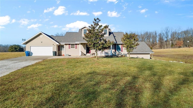 view of front of property featuring a garage and a front yard