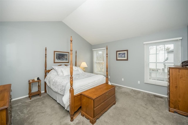 carpeted bedroom with vaulted ceiling