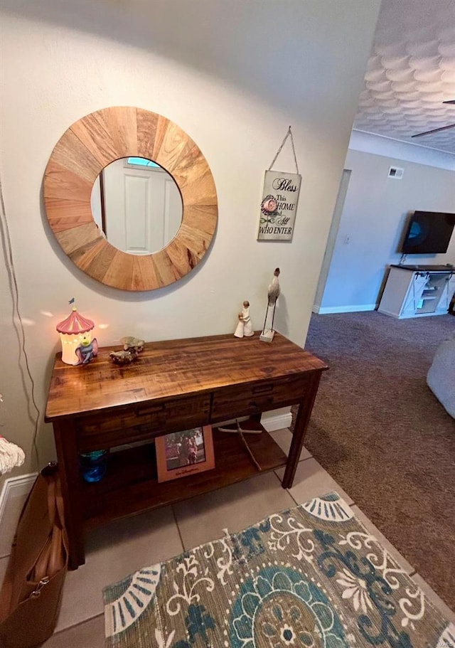 hallway with light colored carpet