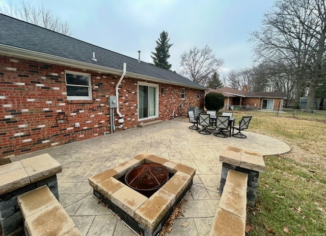 view of patio / terrace with an outdoor fire pit