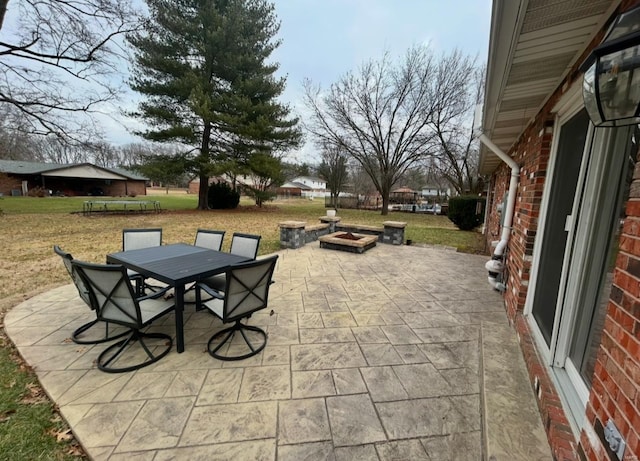 view of patio with a fire pit