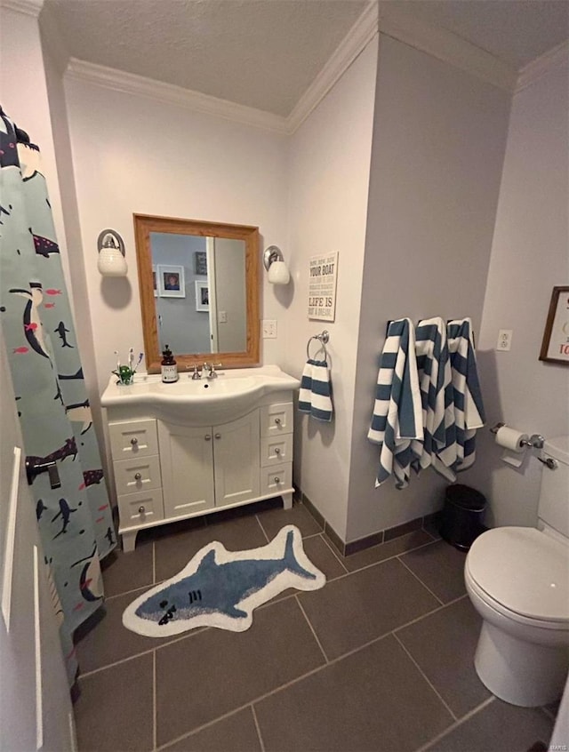 bathroom with ornamental molding, toilet, tile patterned floors, and vanity