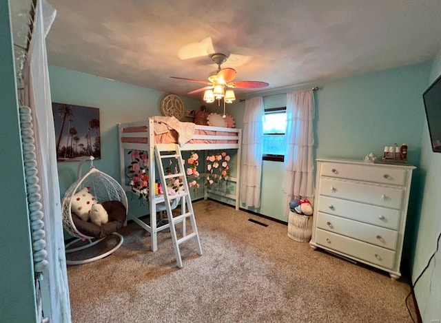 bedroom featuring light colored carpet and ceiling fan