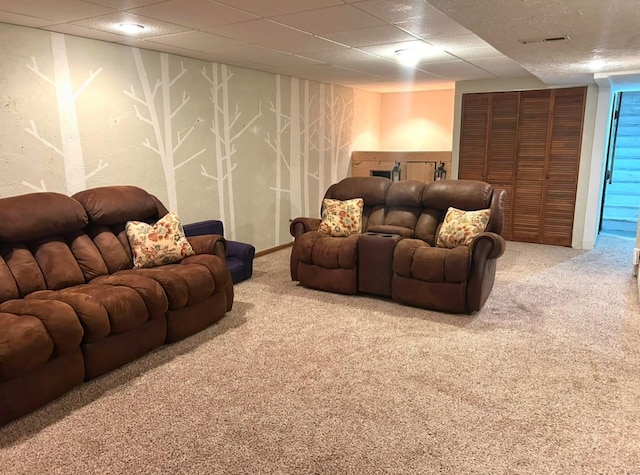 cinema featuring carpet and a drop ceiling