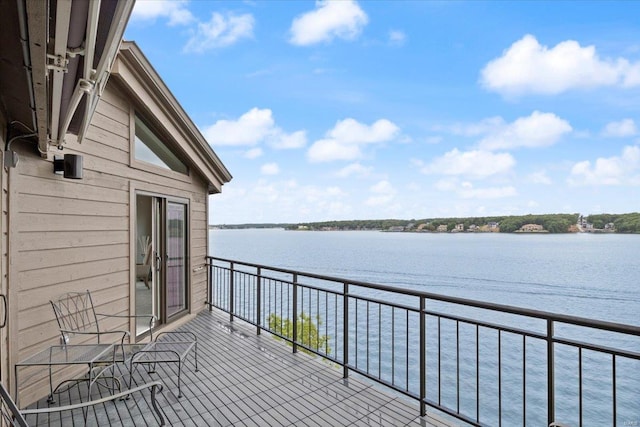 balcony featuring a water view