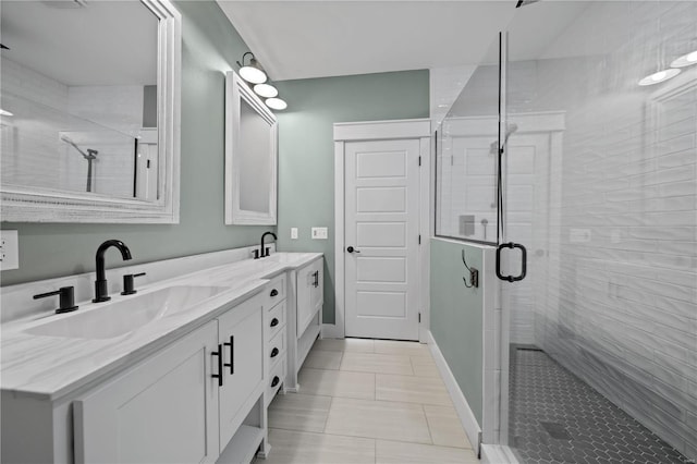 bathroom with vanity, tile patterned flooring, and a shower with door