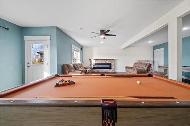 recreation room featuring pool table, a fireplace, and ceiling fan