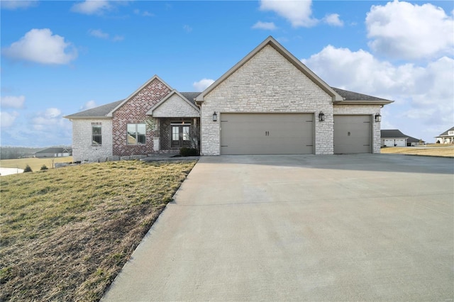 view of front of house with a garage and a front yard