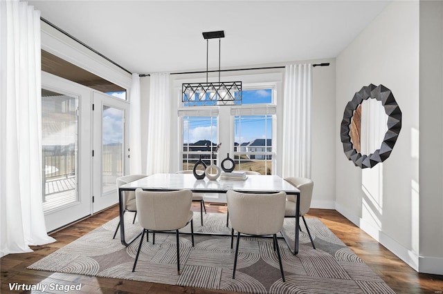 dining space featuring hardwood / wood-style flooring