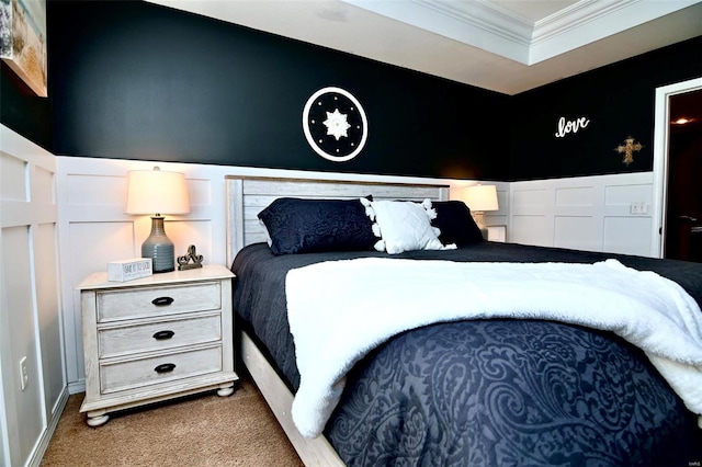 bedroom with ornamental molding and carpet floors