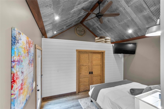 bedroom featuring vaulted ceiling, wooden ceiling, ceiling fan, and light hardwood / wood-style floors