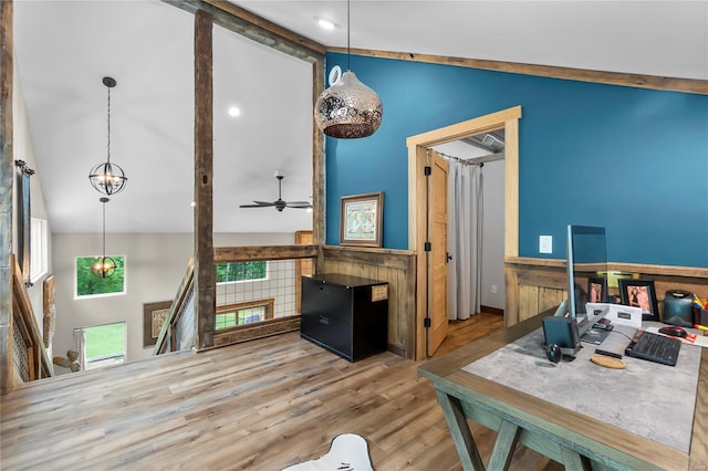 interior space featuring hardwood / wood-style floors, beam ceiling, high vaulted ceiling, and ceiling fan