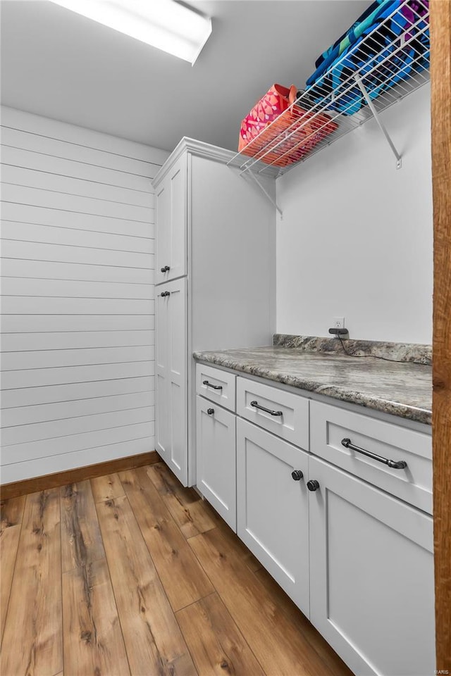 washroom with light hardwood / wood-style flooring