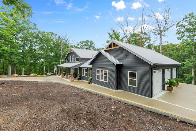 view of front of property featuring a garage and covered porch