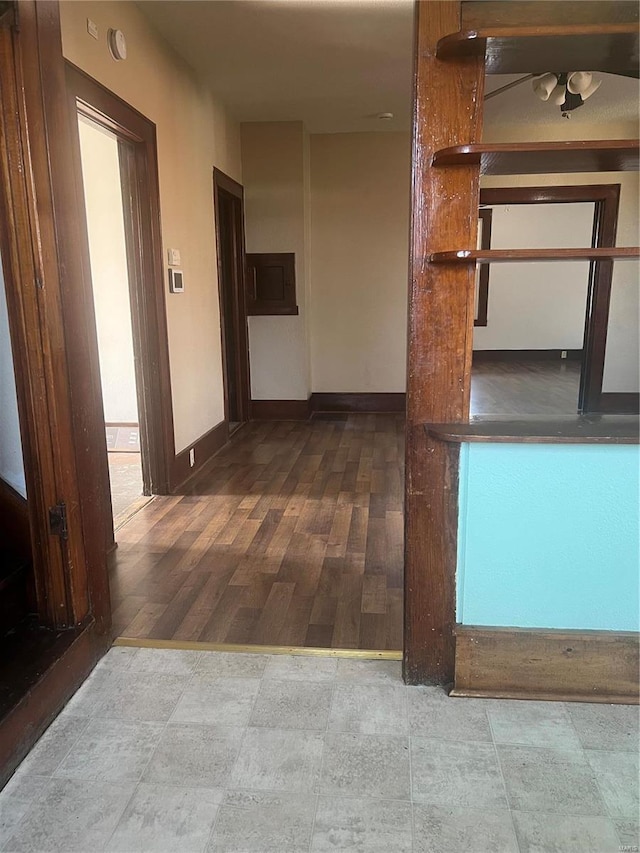 hallway with wood-type flooring