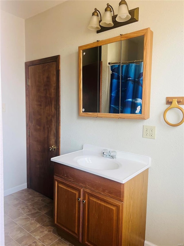 bathroom with vanity and tile patterned floors