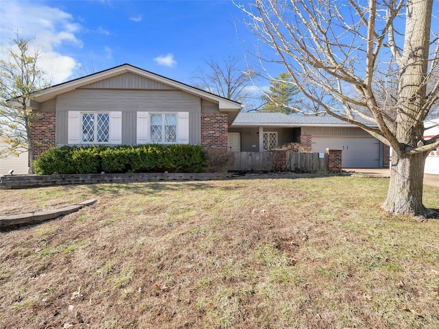 ranch-style home featuring a garage and a front lawn