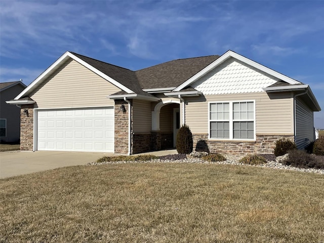 view of front of house with a garage and a front lawn