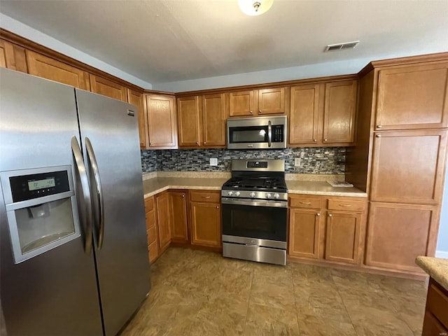 kitchen featuring decorative backsplash and stainless steel appliances