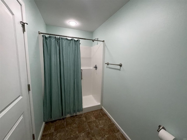 bathroom with a shower with curtain