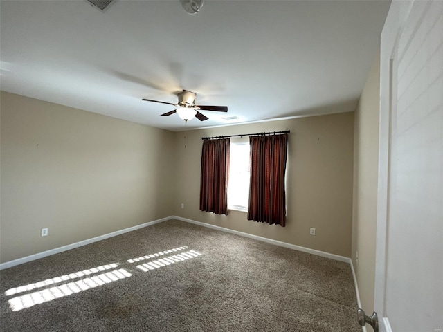 carpeted empty room featuring ceiling fan