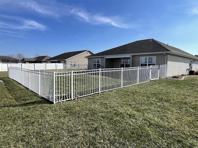 exterior space featuring a lawn and central air condition unit