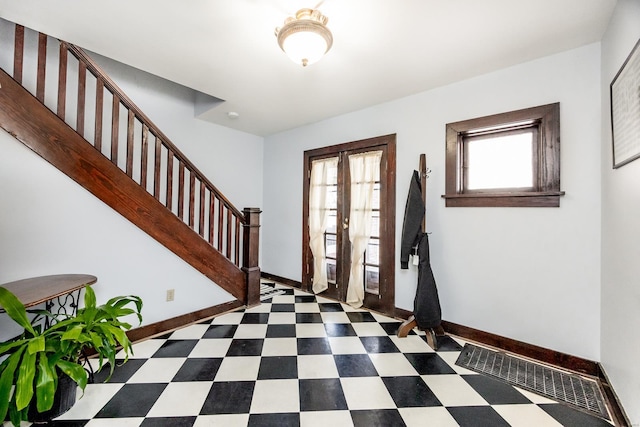 foyer featuring french doors