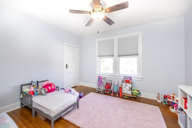 bedroom featuring dark hardwood / wood-style floors and ceiling fan