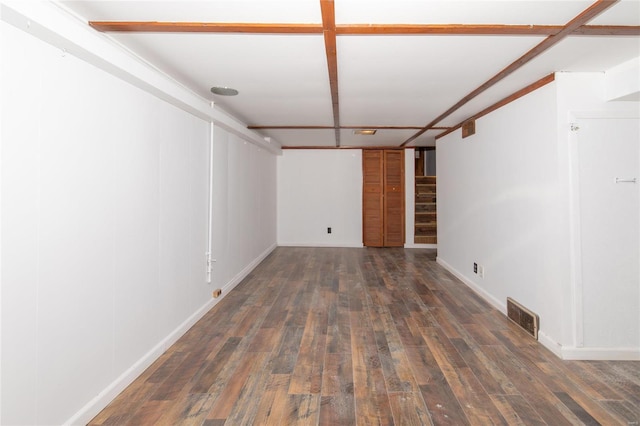 empty room featuring dark hardwood / wood-style flooring