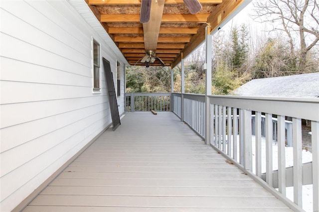 wooden terrace featuring ceiling fan