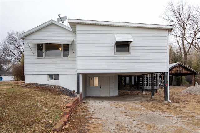 exterior space with driveway and a carport