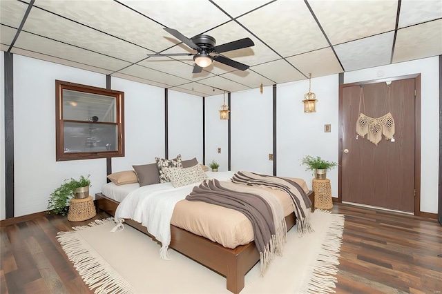 bedroom with a ceiling fan and wood finished floors