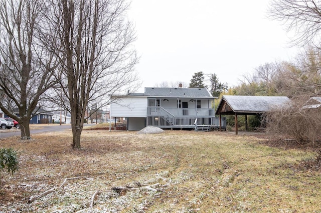 back of property featuring a porch and a carport