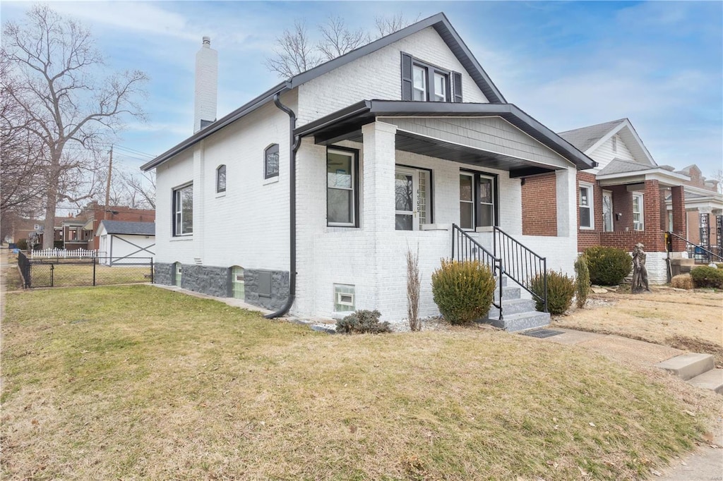 view of front of property with a front yard and a porch