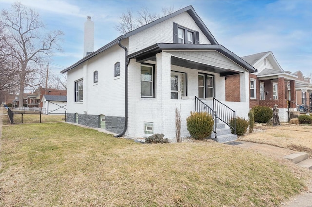 view of front of property with a front yard and a porch