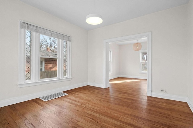 unfurnished dining area featuring hardwood / wood-style flooring