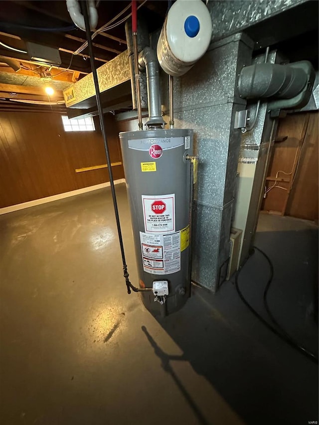 utility room featuring water heater