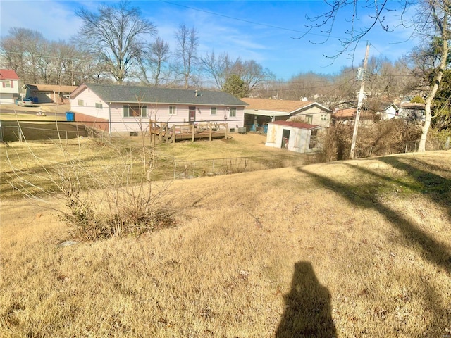 rear view of property with a yard