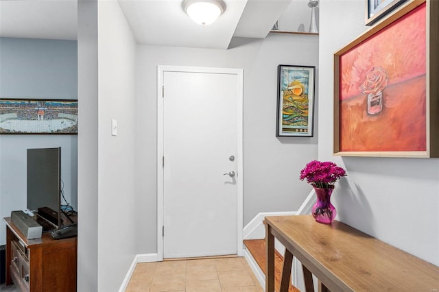 entryway with light tile patterned floors