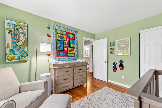 bedroom with dark hardwood / wood-style flooring