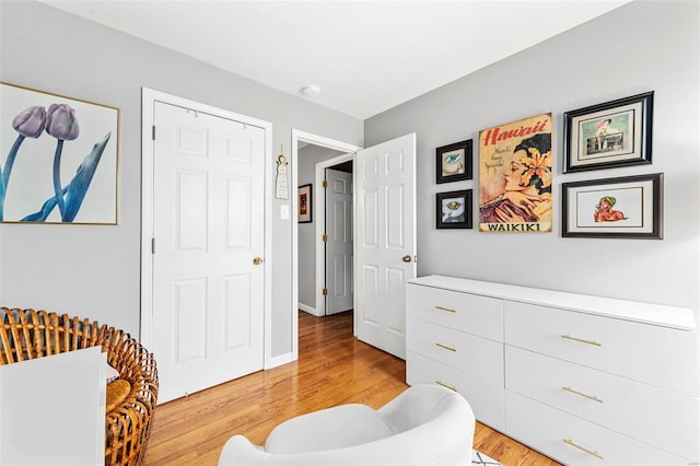 sitting room featuring light hardwood / wood-style flooring