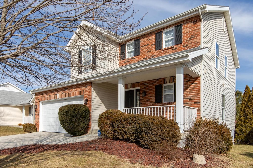 view of front of property with a garage and covered porch