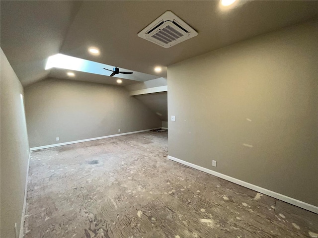 additional living space featuring lofted ceiling, baseboards, visible vents, and ceiling fan