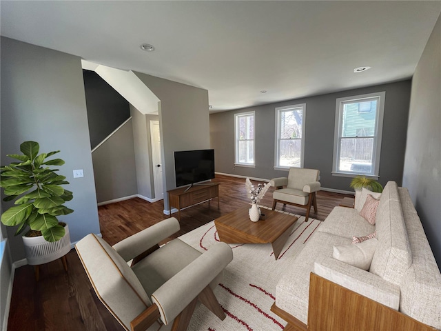 living area with recessed lighting, baseboards, and wood finished floors