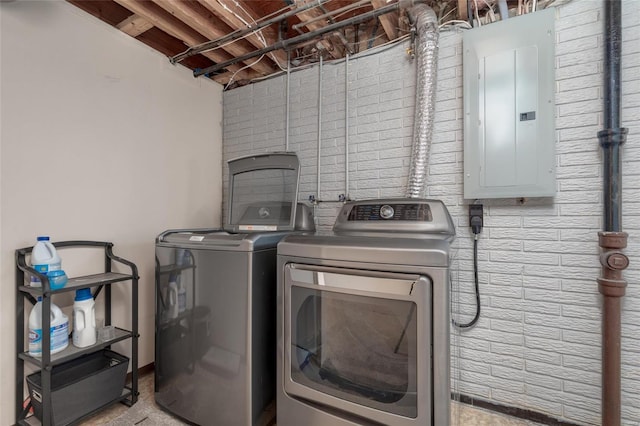 laundry room with separate washer and dryer and electric panel